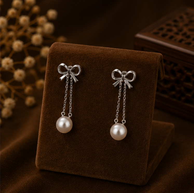 Rosé Bow Pearl Drop Earrings